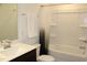 Clean bathroom with a vanity, a mirror, and a shower-tub combination with white tile at 316 Robert Howe Dr, Fuquay Varina, NC 27526
