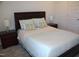 Comfortable bedroom with a well-made bed, two nightstands, and natural light from the nearby windows at 316 Robert Howe Dr, Fuquay Varina, NC 27526