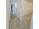 View of walk-in closet with basic shelving and a partial view of an ensuite bathroom with a shower stall at 316 Robert Howe Dr, Fuquay Varina, NC 27526
