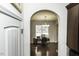 View of dining area from kitchen, showing hardwood floors and chandelier at 4204 Vineyard Ridge Dr, Zebulon, NC 27597