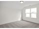 Cozy bedroom with a single window and grey carpet at 432 Old Fashioned Way, Lillington, NC 27546