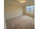 Well-lit bedroom with window and carpet at 432 Old Fashioned Way, Lillington, NC 27546