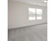 Bright bedroom with large window and grey carpet at 432 Old Fashioned Way, Lillington, NC 27546