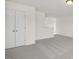 Spacious bedroom with double doors and grey carpet at 432 Old Fashioned Way, Lillington, NC 27546
