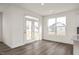 Bright dining area with hardwood floors and access to a back deck at 432 Old Fashioned Way, Lillington, NC 27546