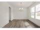 Light-filled dining room with hardwood floors and a chandelier at 432 Old Fashioned Way, Lillington, NC 27546