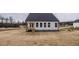 White house exterior with a deck and landscaped yard at 432 Old Fashioned Way, Lillington, NC 27546