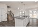 Modern kitchen with white cabinets, granite countertops and island at 432 Old Fashioned Way, Lillington, NC 27546
