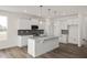 Modern kitchen with white cabinets, granite countertops and stainless steel appliances at 432 Old Fashioned Way, Lillington, NC 27546
