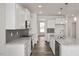 Modern kitchen with white cabinets, granite countertops and stainless steel appliances at 432 Old Fashioned Way, Lillington, NC 27546
