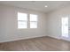 Spacious bedroom with hardwood floors and access to a deck at 65 Wild Turkey Way Way, Lillington, NC 27546