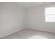 Simple bedroom with carpeted floors and a window at 65 Wild Turkey Way Way, Lillington, NC 27546