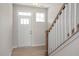 Bright entryway with hardwood floors and a staircase at 65 Wild Turkey Way Way, Lillington, NC 27546