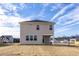 Two-story house with beige siding and a covered porch at 65 Wild Turkey Way Way, Lillington, NC 27546