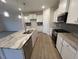 Modern kitchen with granite countertops and stainless steel appliances at 65 Wild Turkey Way Way, Lillington, NC 27546