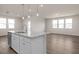Open concept kitchen with island and hardwood floors at 65 Wild Turkey Way Way, Lillington, NC 27546