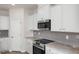 Modern kitchen with granite countertops and stainless steel appliances at 65 Wild Turkey Way Way, Lillington, NC 27546