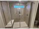 Large walk-in shower with glass enclosure and built-in seat at 65 Wild Turkey Way Way, Lillington, NC 27546