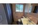 Pink tiled bathroom with vanity and shower at 720 Darby St, Raleigh, NC 27610