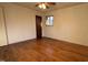 Hardwood floor bedroom with ceiling fan and window at 720 Darby St, Raleigh, NC 27610