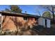 Brick house exterior with detached garage and AC unit at 720 Darby St, Raleigh, NC 27610