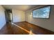 Living room featuring hardwood floors and hallway access at 720 Darby St, Raleigh, NC 27610