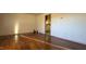 Bright living room with hardwood floors and view into kitchen at 720 Darby St, Raleigh, NC 27610
