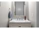 Well-lit bathroom featuring a stylish framed mirror and granite countertops at 722 Redford Place Dr, Rolesville, NC 27571