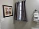 Bathroom with window and decorative picture at 747 Brewers Glynn Ct, Wake Forest, NC 27587