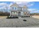 Charming two-story home with stone and siding exterior and well-maintained landscaping at 87 Browning Mill Dr, Wendell, NC 27591