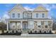 Two-story house with stone and shingle accents, front porch, and landscaping at 87 Browning Mill Dr, Wendell, NC 27591