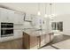 Spacious kitchen featuring white cabinets and a large island at 87 Browning Mill Dr, Wendell, NC 27591