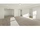 Bright living room featuring recessed lighting and neutral carpet at 87 Browning Mill Dr, Wendell, NC 27591