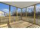 Covered screened-in porch with wood flooring and backyard views at 87 Browning Mill Dr, Wendell, NC 27591