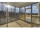Sun-drenched screened porch offering expansive views of the surrounding landscape at 87 Browning Mill Dr, Wendell, NC 27591