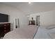 Main bedroom with king-size bed, dresser, and en-suite bathroom access at 1004 Gold Cir, Mebane, NC 27302