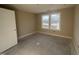 Well-lit bedroom with neutral walls and large window at 210 Maxwell Farm Ln, Selma, NC 27576