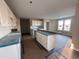 Kitchen with island and white cabinets at 210 Maxwell Farm Ln, Selma, NC 27576