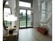 Elegant foyer with a statement mirror, hardwood floors, and modern staircase with glass railing at 216 Dartmouth Rd, Raleigh, NC 27609
