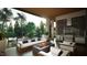 Inviting covered patio with outdoor kitchen, multiple seating areas and fire features for cozy outdoor entertaining at 216 Dartmouth Rd, Raleigh, NC 27609
