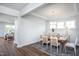 Bright dining room with wood table and seating for six at 247 Circle City Way, Pittsboro, NC 27312