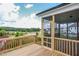 Spacious deck with screened porch offering scenic neighborhood views at 257 Circle City Way, Pittsboro, NC 27312
