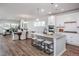 Open concept kitchen with island, stainless steel appliances, and granite countertops at 257 Circle City Way, Pittsboro, NC 27312