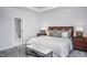 Main bedroom with king-size bed, ensuite bathroom access, and wood nightstands at 257 Circle City Way, Pittsboro, NC 27312