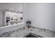 Built-in home office space with granite countertop and kitchen view at 257 Circle City Way, Pittsboro, NC 27312