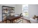 Bright home office features built-in shelving and a large window at 257 Circle City Way, Pittsboro, NC 27312