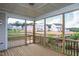 Relaxing screened porch with wooden deck and view of neighborhood at 257 Circle City Way, Pittsboro, NC 27312