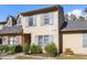 Charming two-story townhouse with blue shutters and well-maintained landscaping at 14 Stone Village Ct, Durham, NC 27704