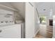 Laundry room with washer and dryer hookups, built-in shelves, and access to the backyard at 14 Stone Village Ct, Durham, NC 27704
