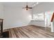 Spacious living room with hardwood floors, fireplace, staircase and breakfast bar with a bright kitchen at 14 Stone Village Ct, Durham, NC 27704